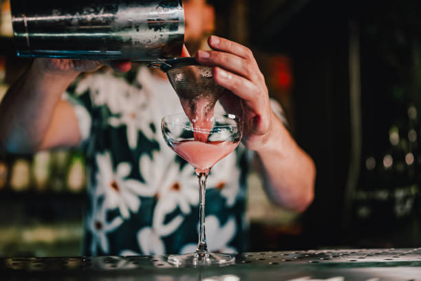 istock man hand bartender making sweet and sour refreshing cocktail on the bar counter 1414752289