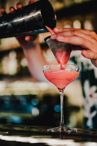 istock man hand bartender making sweet and sour refreshing cocktail on the bar counter 1414752298