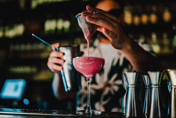 istock man hand bartender making sweet and sour refreshing cocktail on the bar counter 1414752312