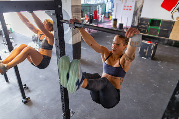 istock Exercising chin-ups in a gym 1414752370