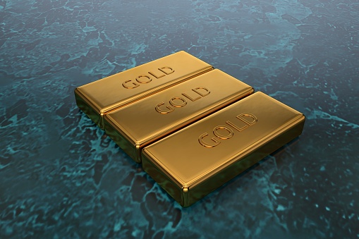 3D gold bars lie on a dark textured surface. The concept of the world financial crisis, sanctions and losses