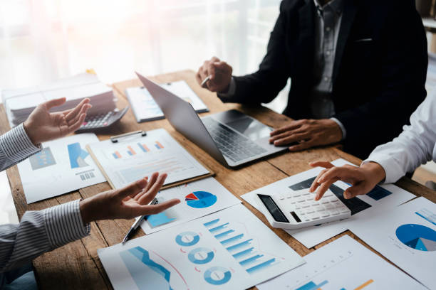 istock Professional management business team brainstorm meetings to plan investment projects, work together and analyze market data graphs. 1414756368