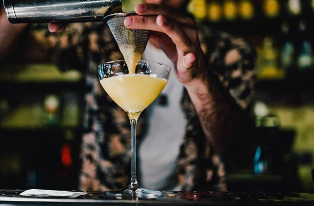 istock man hand bartender making sweet and sour refreshing cocktail on the bar counter 1414758642