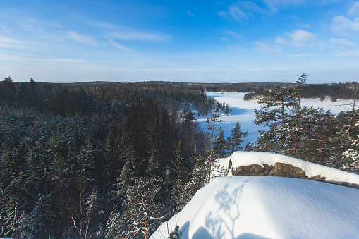 Repovesi National Park, aerial winter view, landscape view of a finnish park, southern Finland, Kouvola and Mantyharju, region of Kymenlaakso, with a group of tourists and the wooden infrastructure