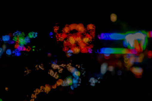 Colorful defocused bokeh lights with black background