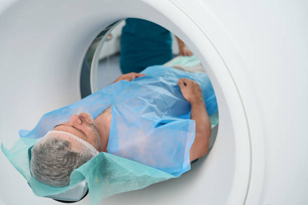 istock Man is undergoing abdominal tomography procedure in clinic 1414762401