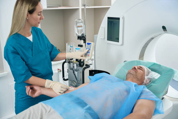 istock Nurse puts a dropper on a man patient 1414762418