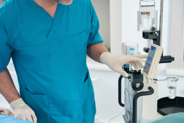 istock Diagnostician works with contrast control injector in modern diagnostics room 1414762448