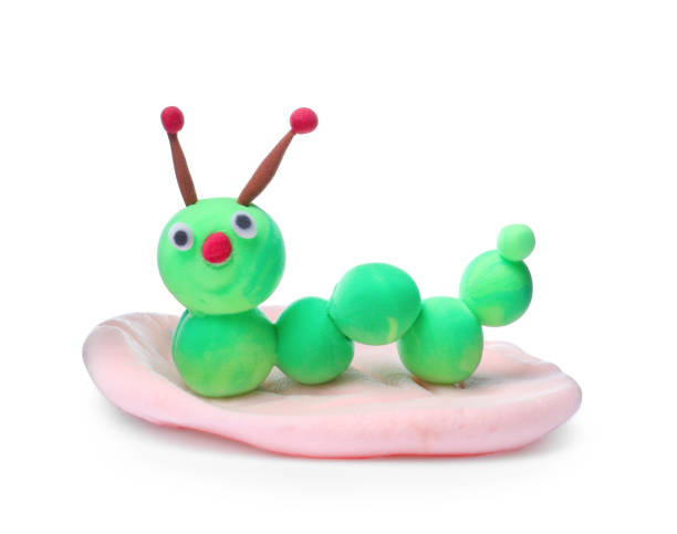 istock Colorful caterpillar made from play dough isolated on white 1414763602
