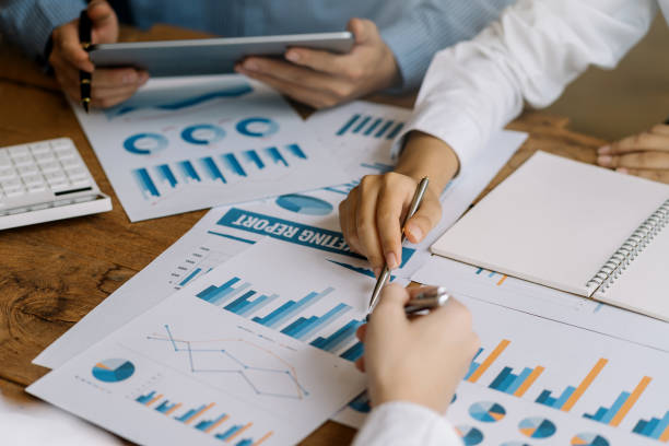 istock Business people are analyzing data graphs to plan business meetings with colleagues to propose collaboration strategies. 1414763810