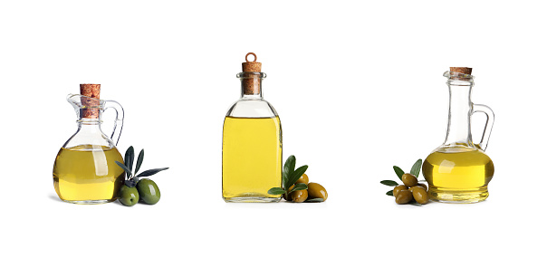 Set with oil, ripe olives and leaves on white background. Banner design