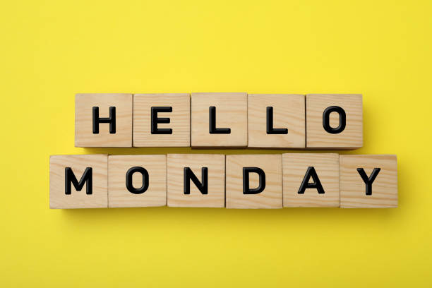 istock Wooden cubes with message Hello Monday on yellow background, flat lay 1414765075