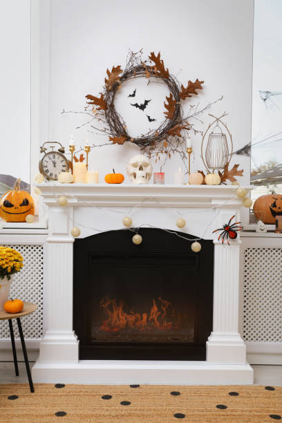 istock Modern room with fireplace decorated for Halloween. Festive interior 1414766295