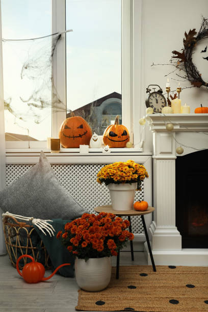 istock Modern room with fireplace decorated for Halloween. Festive interior 1414766308