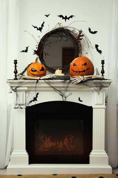 istock Different Halloween decor on mantelpiece indoors. Festive interior 1414766330