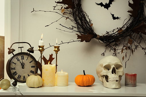 Different Halloween decor on table indoors. Festive interior