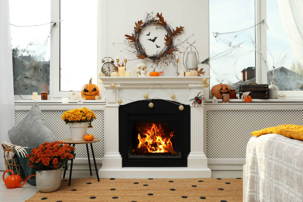 istock Modern room with fireplace decorated for Halloween. Festive interior 1414766455