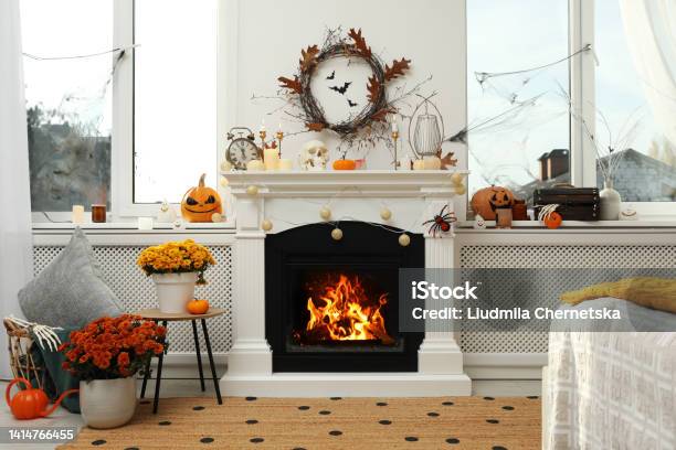 Modern Room With Fireplace Decorated For Halloween Festive Interior Stock Photo - Download Image Now