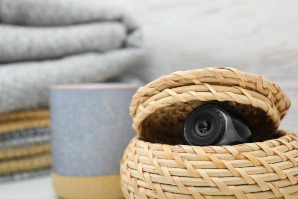 istock Camera hidden in wicker box, closeup. Space for text 1414766544