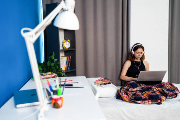 Young female student studying in a University campus room stock photo