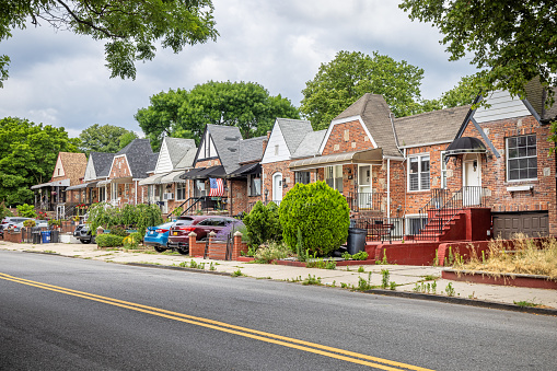 Brooklyn, New York, NY, USA - July 6th 2022: Residential brownstone row houses on Greenwood Avenue which is a suburban area