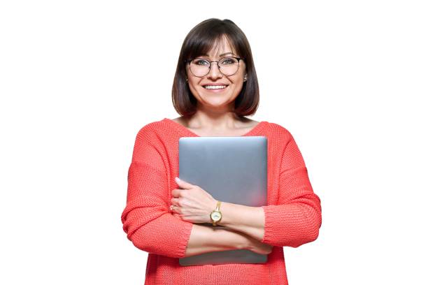 istock Smiling woman with laptop on white isolated background 1414773089