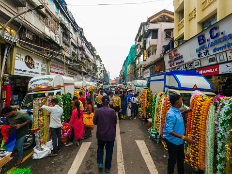 Wide angle shot of cheap decoration market held at Masjid Bunder Road just before the Ganapati Festival in Mumbai, India