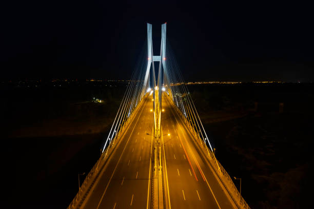 highway with the bridge at night (aerial) - wroclaw traffic night flowing imagens e fotografias de stock