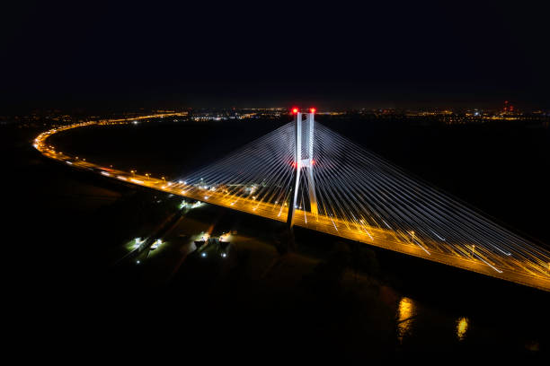 istock highway with the bridge at night (aerial) 1414774060