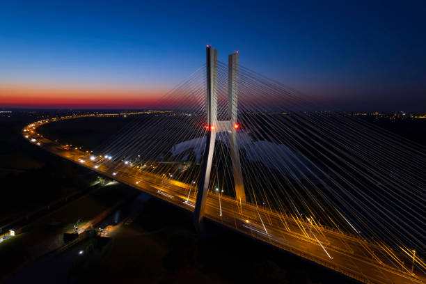 highway with the bridge at night (aerial) - wroclaw traffic night flowing imagens e fotografias de stock