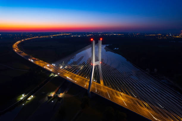 highway with the bridge at night (aerial) - wroclaw traffic night flowing imagens e fotografias de stock
