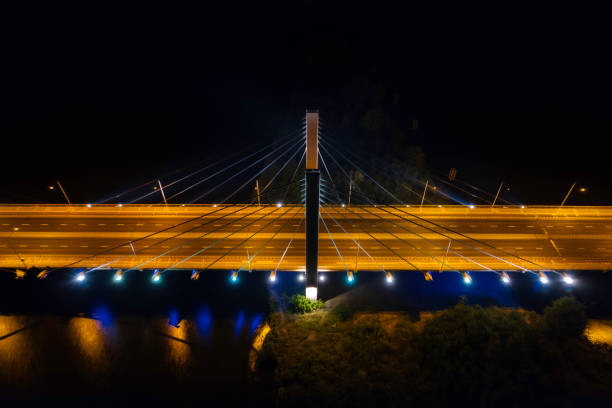 istock highway with the bridge at night (aerial) 1414774186