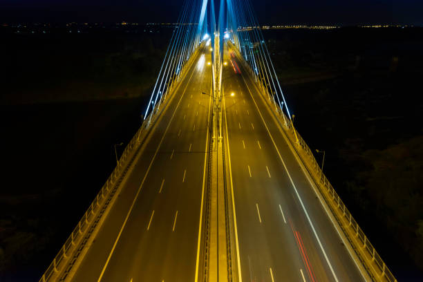 istock highway with the bridge at night (aerial) 1414774234