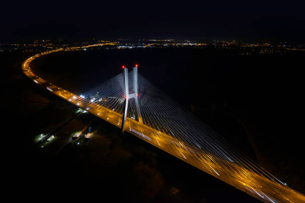 highway with the bridge at night (aerial) - wroclaw traffic night flowing imagens e fotografias de stock