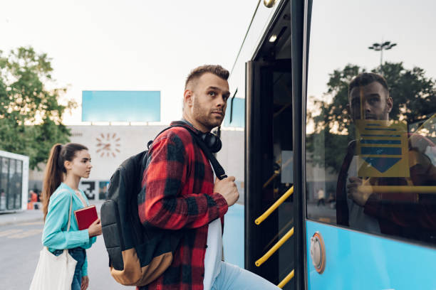 istock Man entering the bus while traveling in the city 1414774319