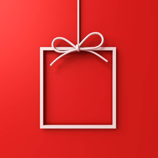 istock Hanging gift box frame border isolated on red background with shadow minimal conceptual 3D rendering 1414775307