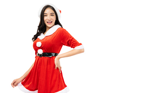 Young woman wearing red Santa Claus costume and Santa Claus Hat Look at camera with surprised face isolated on white background copy space Christmas x-mas winter happiness holiday and party concept
