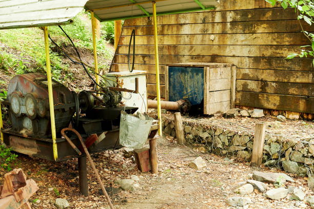 Old small manual hydroelectric power station with engine a small stream