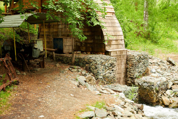 istock Old small manual hydroelectric power station on a small stream 1414778450