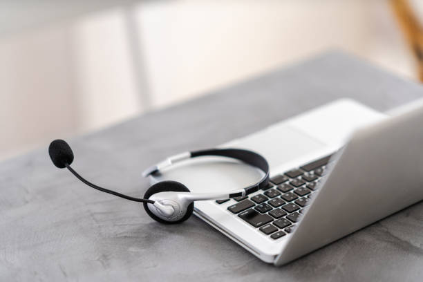 istock Gray desk with laptop 1414779494