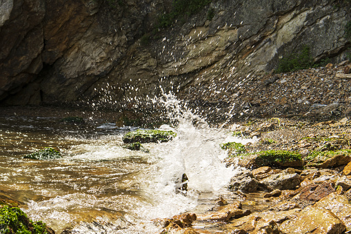 splashes of water over rocks