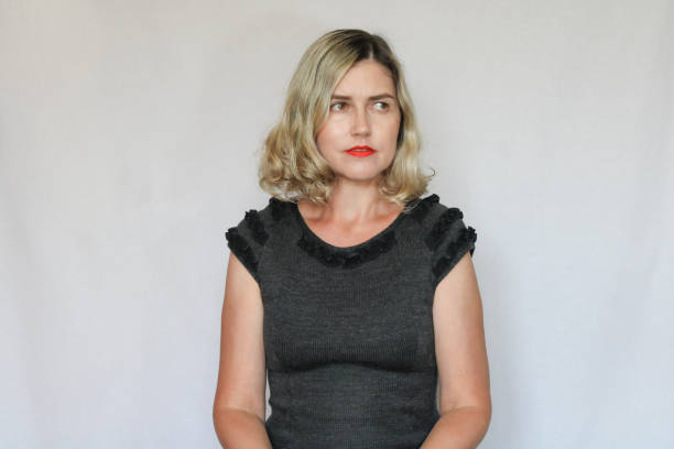 istock Beautiful middle-aged blond woman on a white background 1414779673
