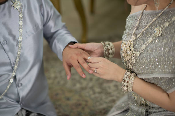 istock wear a ring, wedding ring, love couple 1414780499