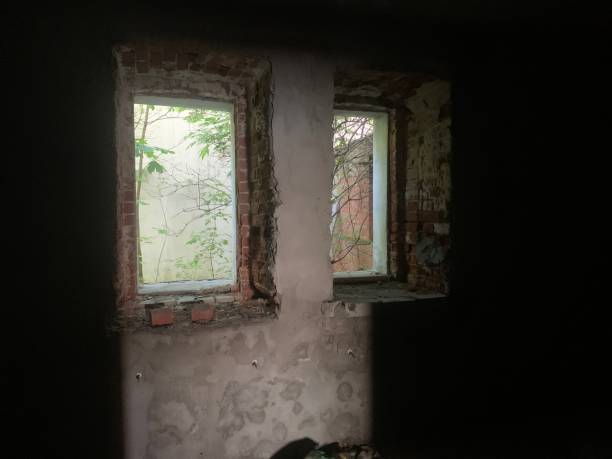 istock Dark room window of abandoned house 1414780718