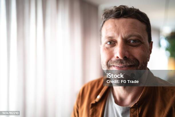 Portrait Of A Mature Man At Home Stock Photo - Download Image Now - Portrait, People, Adult