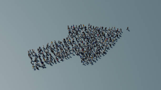 istock Arrow made of people point towards a leader 1414784581