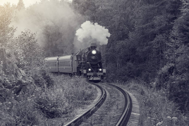 istock Retro steam train approaches to the platform. 1414784816