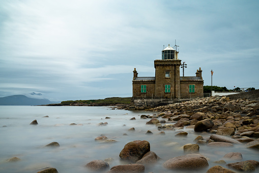 A long exposure view of the historic 19th-century Blacksod Lighthouse on the Mullet Peninsula in County Mayo in Ireland