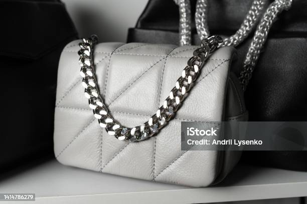 Quilted Bag On The Shelf In The Store Close Up Of Leather Bags In Store Window Stock Photo - Download Image Now