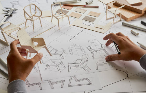 istock Designer sketching drawing design development product plan draft chair armchair Wingback Interior furniture prototype manufacturing production. designer studio concept . 1414787832